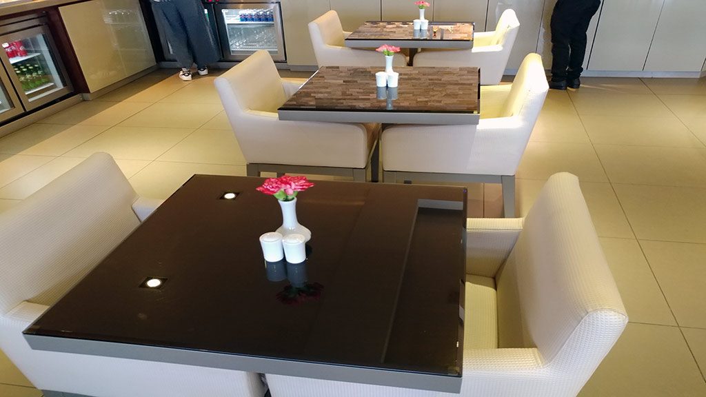 Comfortable dining chairs in the Emirates lounge in Kuala Lumpur